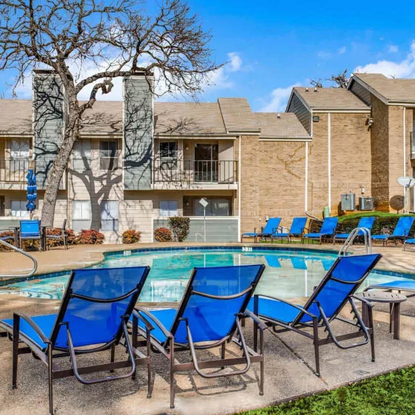 outdoor pool with lounge chairs
